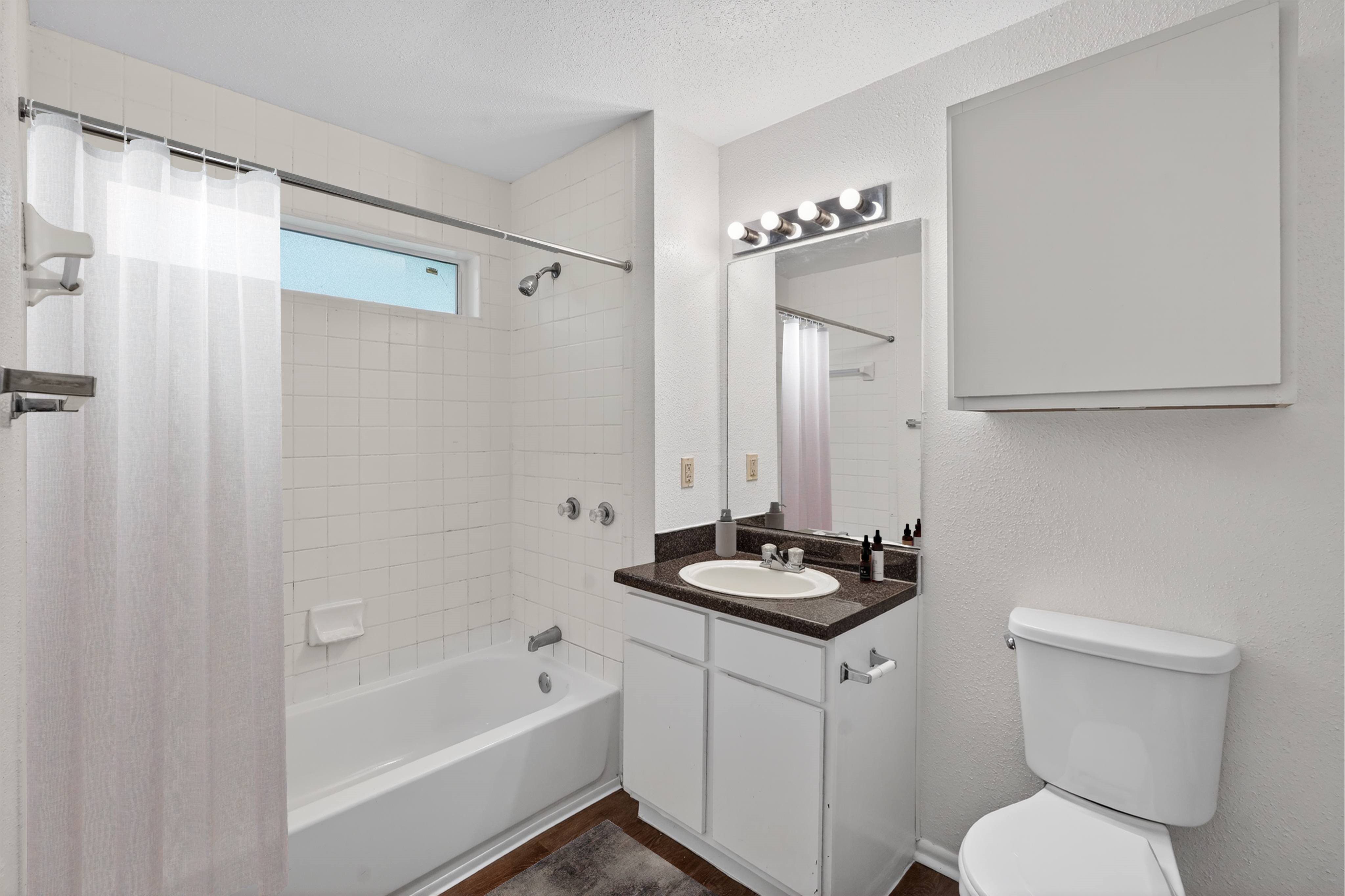 Bathroom at Dayton Park Apartments in Dayton TX